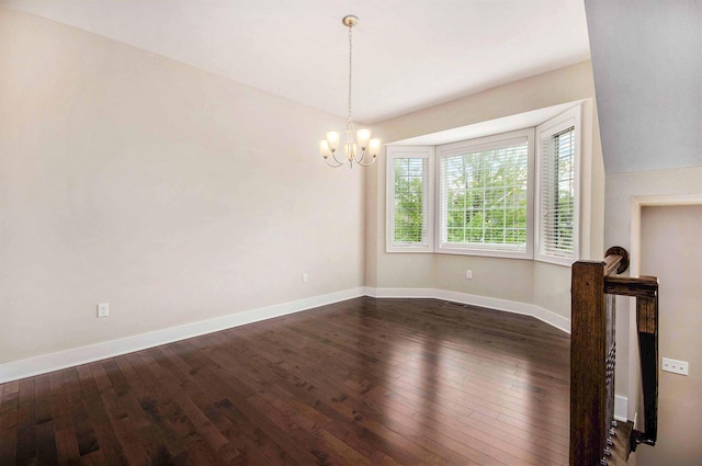 2512 W Liberty St, Ann Arbor, MI 48103 - empty room with a chandelier, dark wood-style flooring, and baseboards