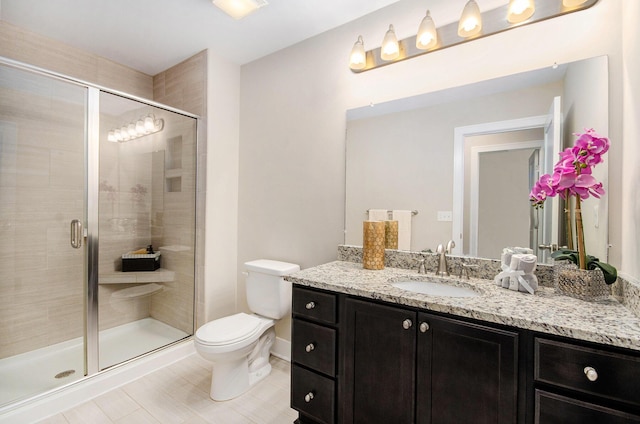 2512 W Liberty St, Ann Arbor, MI 48103 - full bath with vanity, toilet, a stall shower, and tile patterned flooring