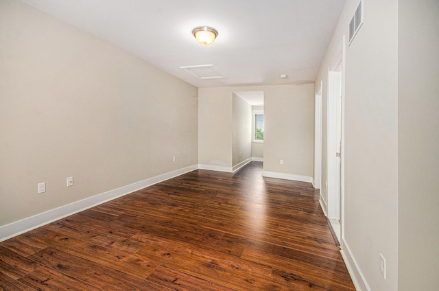 2512 W Liberty St, Ann Arbor, MI 48103 - unfurnished room featuring attic access, dark wood-style floors, and baseboards