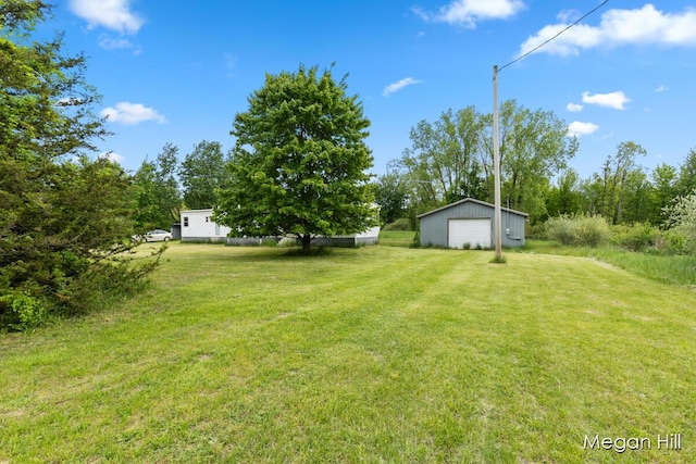 3570 109th Ave, Allegan, MI 49010 - view of grassy yard with a garage and an outdoor structure