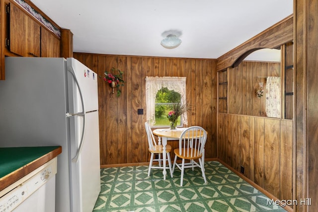 3570 109th Ave, Allegan, MI 49010 - dining space with wood walls and tile patterned floors
