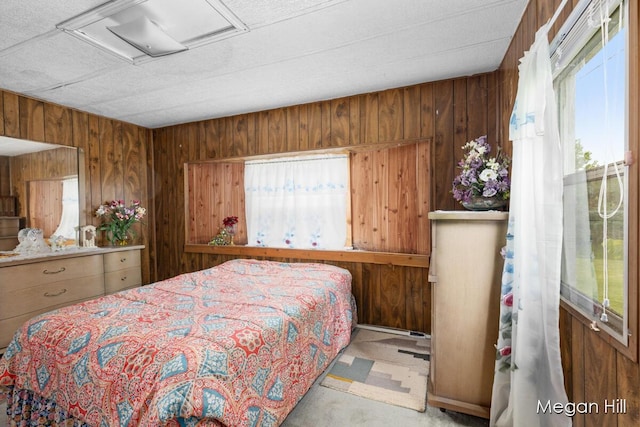 3570 109th Ave, Allegan, MI 49010 - bedroom featuring attic access, wood walls, and carpet floors