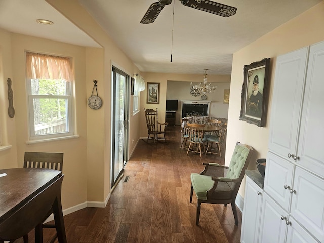 8862 W Rainbow Lake Dr, Baldwin, MI 49304 - hall featuring dark wood-style flooring, baseboards, and a chandelier