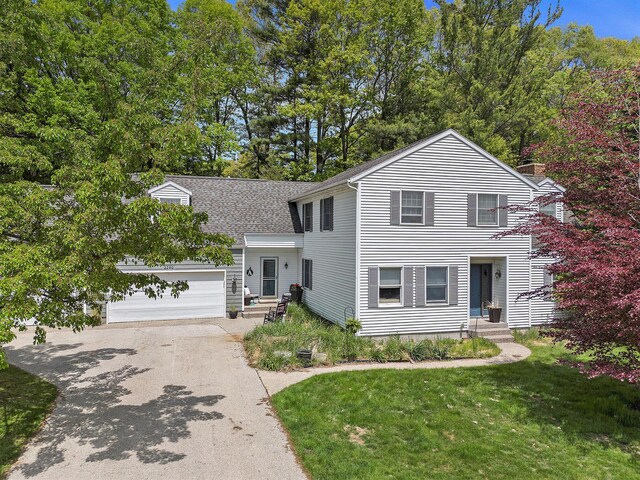 2290 Blissfield Ct, Muskegon, MI 49441 - view of front of home with asphalt driveway, roof with shingles, a front lawn, and a garage