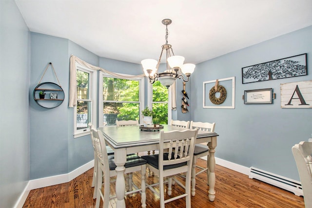 2290 Blissfield Ct, Muskegon, MI 49441 - dining space with a baseboard radiator, a chandelier, baseboards, and wood finished floors