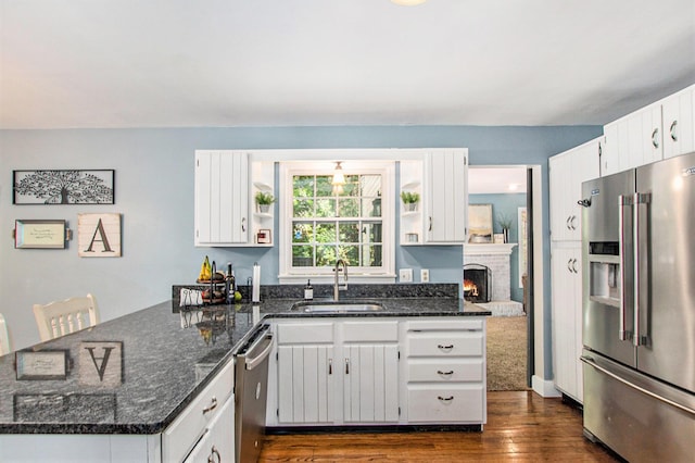 2290 Blissfield Ct, Muskegon, MI 49441 - kitchen featuring stainless steel appliances, a sink, a peninsula, open shelves, and dark wood-style floors