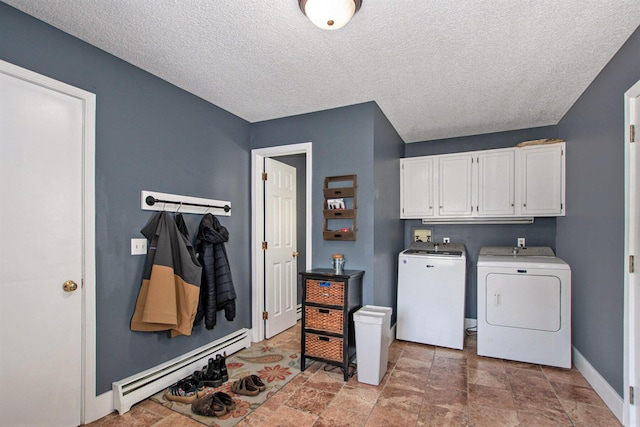 2290 Blissfield Ct, Muskegon, MI 49441 - washroom featuring separate washer and dryer, cabinet space, a baseboard heating unit, baseboards, and light stone finish floors
