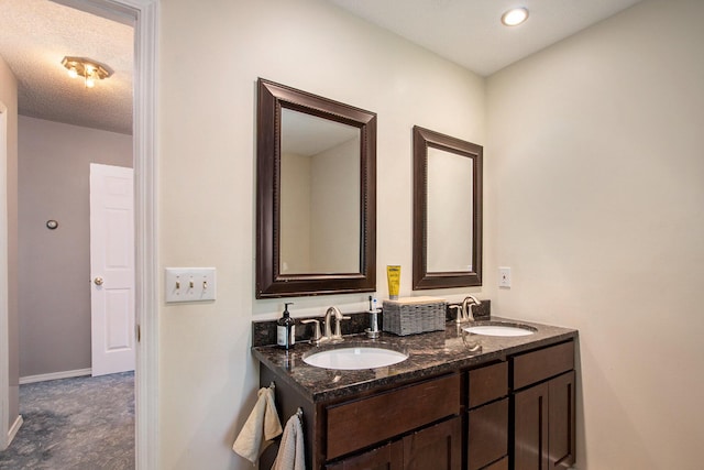 2290 Blissfield Ct, Muskegon, MI 49441 - bathroom with double vanity and baseboards