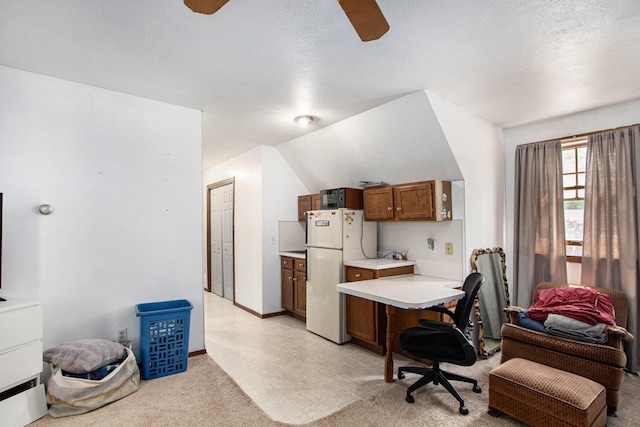 2290 Blissfield Ct, Muskegon, MI 49441 - office area with ceiling fan, light colored carpet, a textured ceiling, lofted ceiling, and baseboards