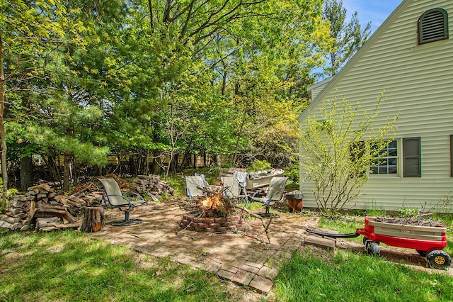 2290 Blissfield Ct, Muskegon, MI 49441 - view of yard with a fire pit and a patio