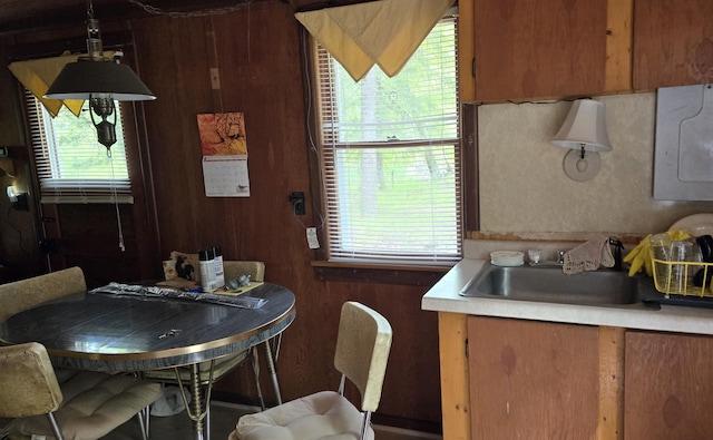 1385 W Channel St, Bitely, MI 49309 - kitchen with a sink, brown cabinetry, and light countertops