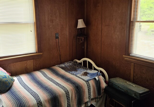 1385 W Channel St, Bitely, MI 49309 - bedroom with multiple windows and wooden walls