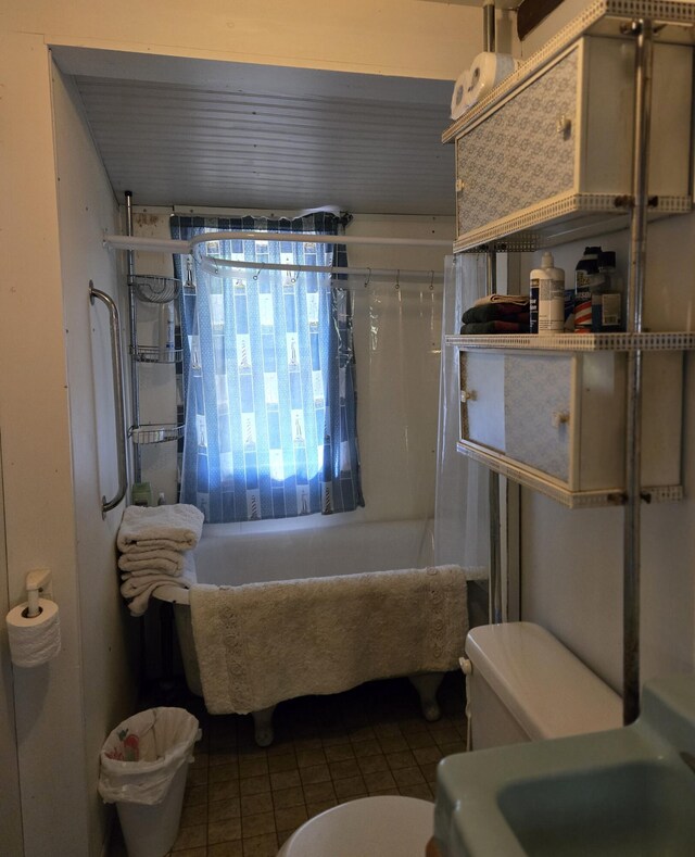 1385 W Channel St, Bitely, MI 49309 - bathroom featuring a tub to relax in, toilet, tile patterned flooring, and a shower with shower curtain