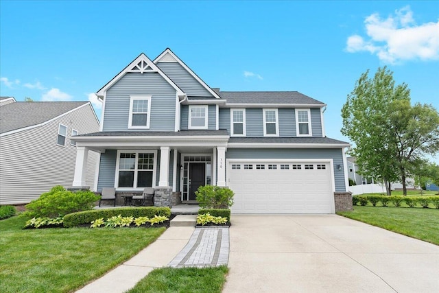 310 Fletcher St, Wixom, MI 48393 - craftsman inspired home with covered porch, a front yard, driveway, and an attached garage