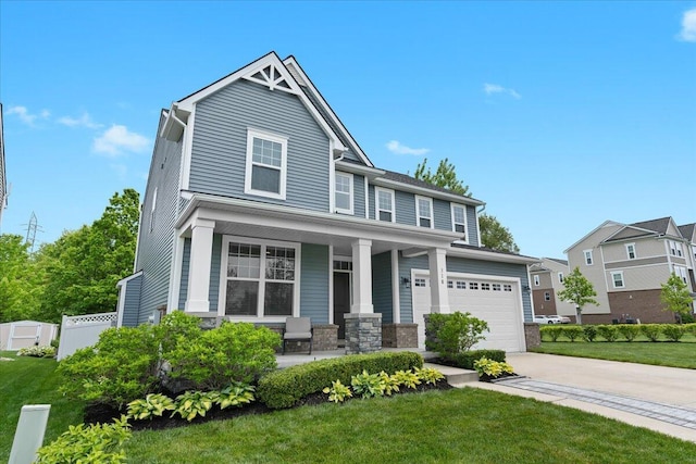 310 Fletcher St, Wixom, MI 48393 - view of front of house with a porch, driveway, a front yard, and a garage