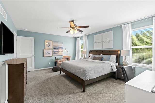 310 Fletcher St, Wixom, MI 48393 - bedroom with light carpet, ceiling fan, and baseboards