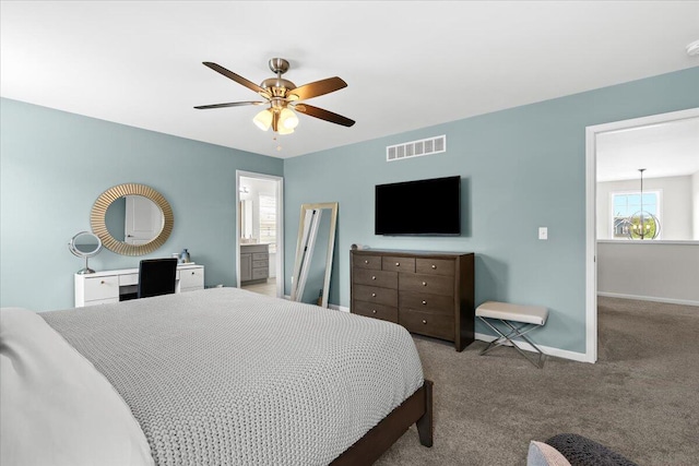 310 Fletcher St, Wixom, MI 48393 - carpeted bedroom with baseboards, ceiling fan, and connected bathroom