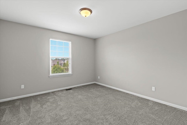 310 Fletcher St, Wixom, MI 48393 - carpeted spare room with baseboards