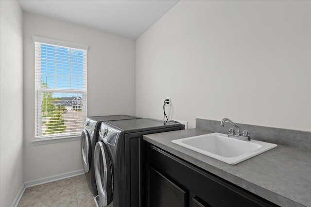 310 Fletcher St, Wixom, MI 48393 - washroom with cabinet space, washing machine and dryer, and baseboards