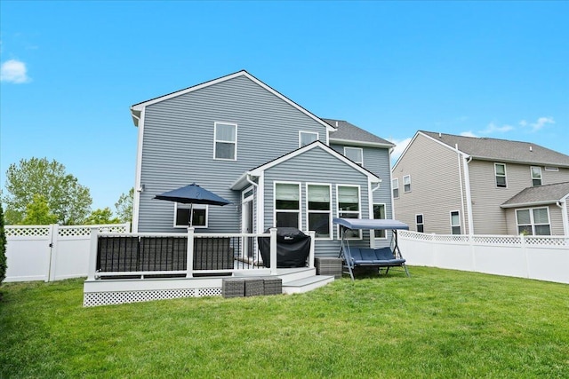 310 Fletcher St, Wixom, MI 48393 - back of property featuring a deck