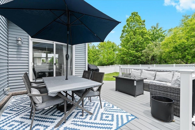 310 Fletcher St, Wixom, MI 48393 - wooden deck with an outdoor living space, a fenced backyard, outdoor dining space, and a grill