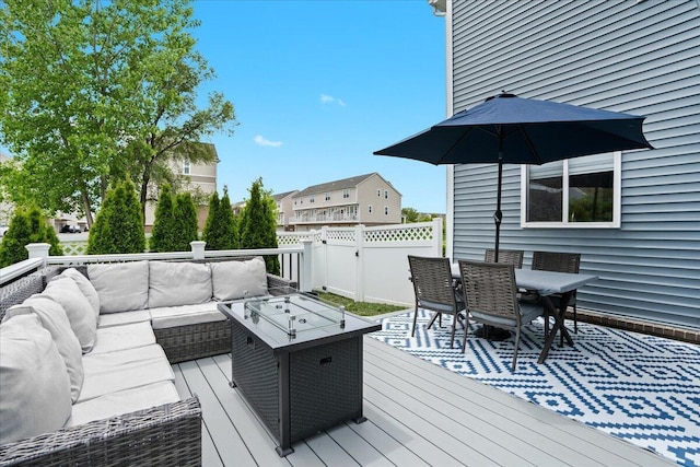 310 Fletcher St, Wixom, MI 48393 - wooden deck featuring an outdoor living space and outdoor dining area