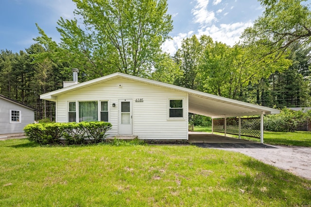 6185 N Shore Dr, Coloma, MI 49038 - view of front facade with asphalt driveway, a front lawn, and an attached carport