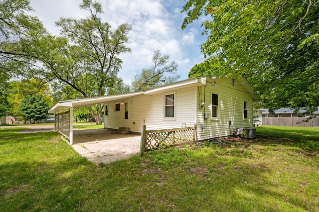 6185 N Shore Dr, Coloma, MI 49038 - back of property featuring a carport and central AC