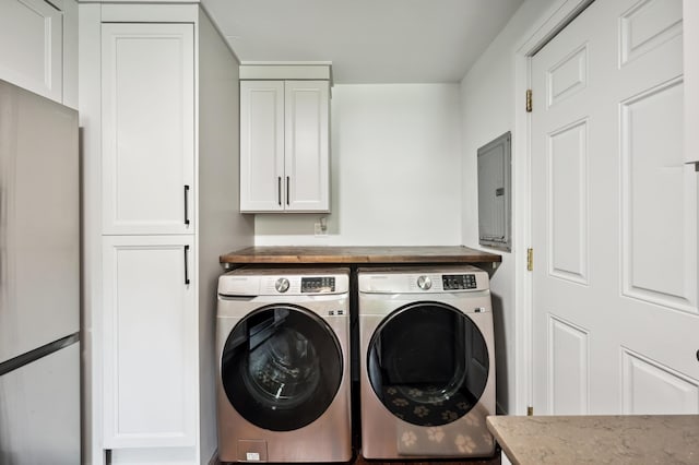 6185 N Shore Dr, Coloma, MI 49038 - washroom featuring washer and clothes dryer, electric panel, and cabinet space