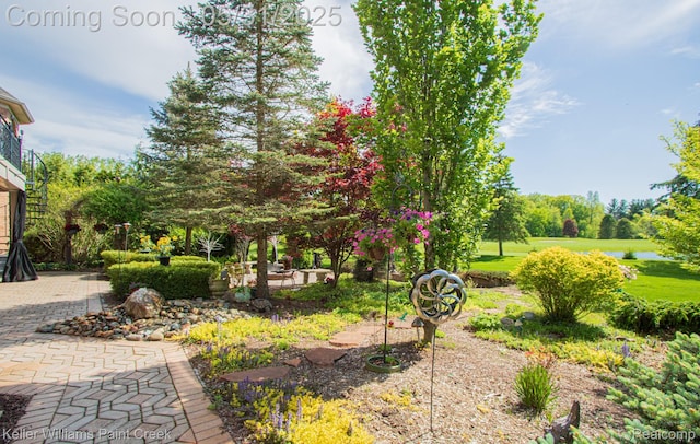 72755 Solanus Dr, Bruce, MI 48065 - view of yard featuring a patio and a water view
