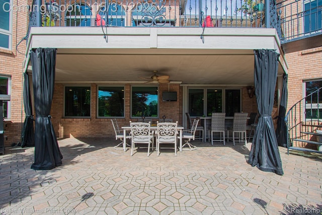 72755 Solanus Dr, Bruce, MI 48065 - view of patio with outdoor dining space, a balcony, and a ceiling fan