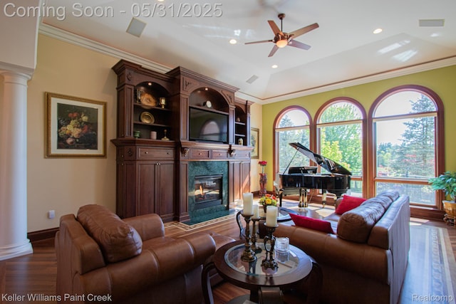 72755 Solanus Dr, Bruce, MI 48065 - living room featuring decorative columns, dark wood-style flooring, a fireplace, a ceiling fan, and baseboards