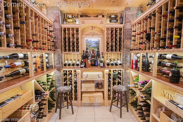 72755 Solanus Dr, Bruce, MI 48065 - wine area with tile patterned floors and wood ceiling