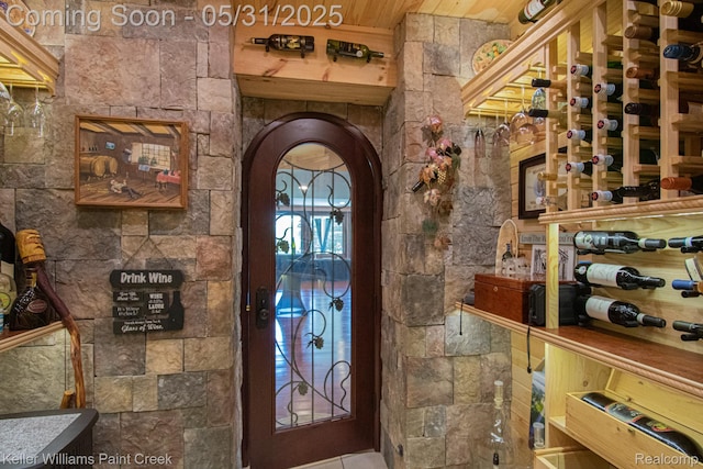 72755 Solanus Dr, Bruce, MI 48065 - wine room featuring arched walkways and wooden ceiling