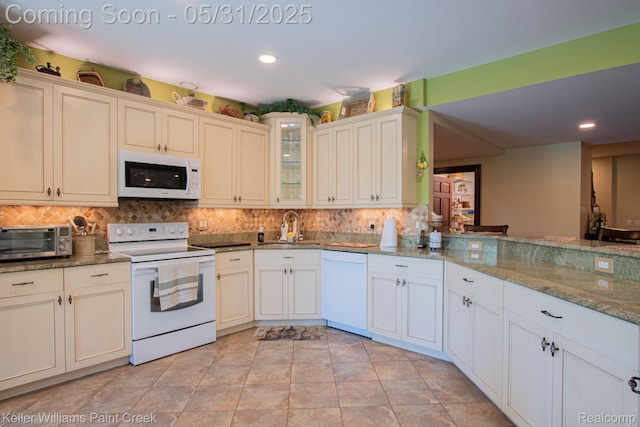 72755 Solanus Dr, Bruce, MI 48065 - kitchen with white appliances, backsplash, a sink, recessed lighting, and glass insert cabinets