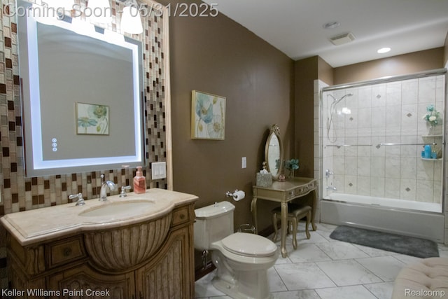 72755 Solanus Dr, Bruce, MI 48065 - bathroom with toilet, vanity, combined bath / shower with glass door, marble finish floors, and tasteful backsplash