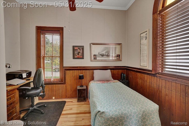 6624 Jefferson Rd, North Branch, MI 48461 - bedroom featuring wood finished floors, ornamental molding, wood walls, an office area, and a wainscoted wall