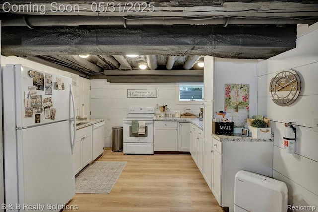 6624 Jefferson Rd, North Branch, MI 48461 - kitchen with white appliances, white cabinetry, light wood-style flooring, light stone countertops, and a sink