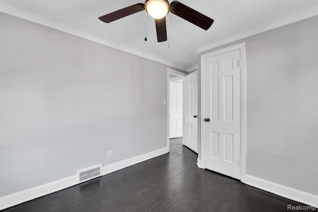 15480 Asbury Park, Detroit, MI 48227 - unfurnished room with baseboards, a ceiling fan, and dark wood-style floors
