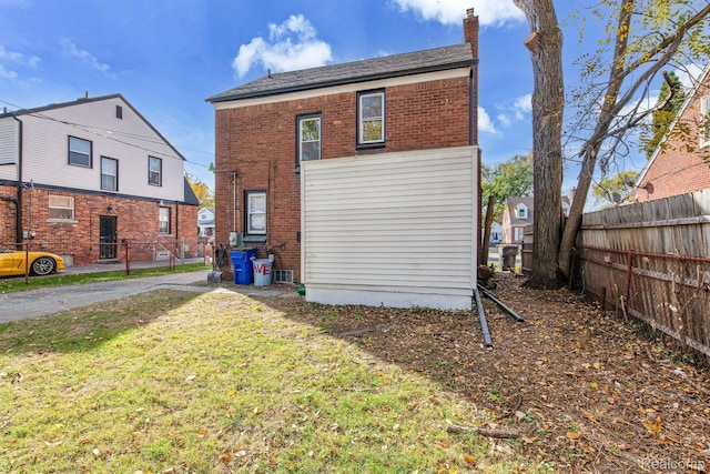 15480 Asbury Park, Detroit, MI 48227 - back of property featuring brick siding and a chimney
