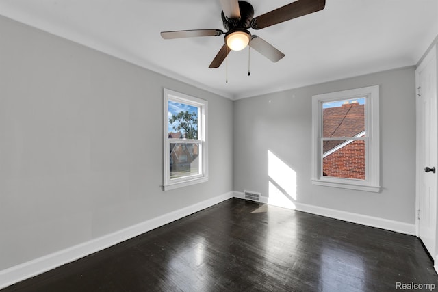 15480 Asbury Park, Detroit, MI 48227 - unfurnished room with healthy amount of natural light, baseboards, wood finished floors, and a ceiling fan