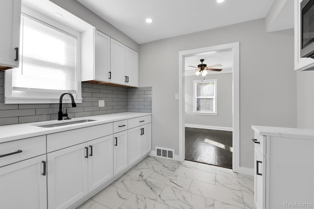 15480 Asbury Park, Detroit, MI 48227 - kitchen with ceiling fan, baseboards, a sink, white cabinetry, and recessed lighting