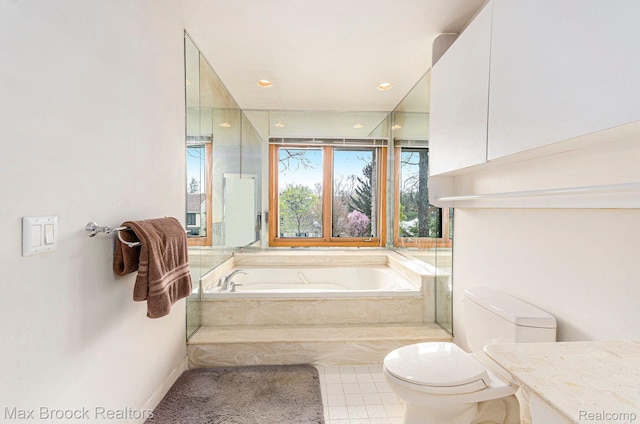 5322 Pond Bluff Dr, West Bloomfield, MI 48323 - bathroom featuring toilet, a garden tub, vanity, and tile patterned flooring
