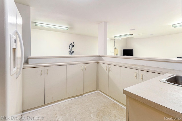 5322 Pond Bluff Dr, West Bloomfield, MI 48323 - kitchen featuring white refrigerator with ice dispenser, light countertops, and light tile patterned floors