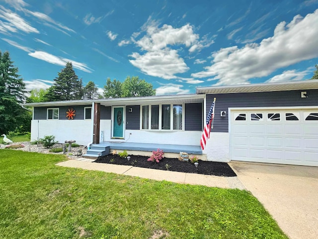 10040 S Reese Rd, Birch Run, MI 48415 - ranch-style home with a garage, a front yard, driveway, and brick siding