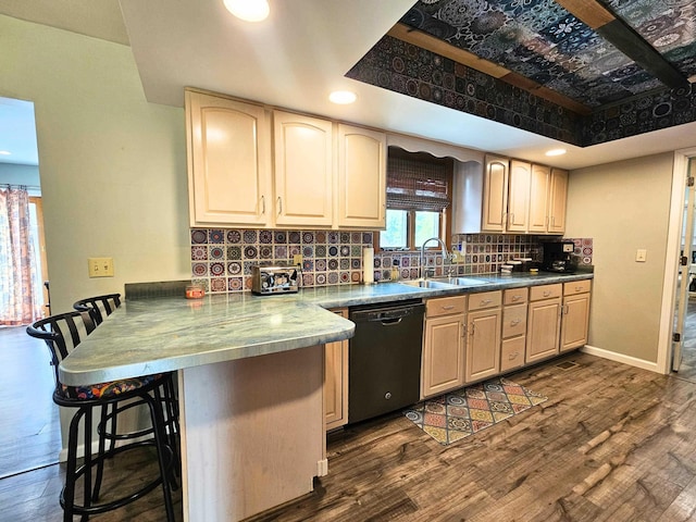 10040 S Reese Rd, Birch Run, MI 48415 - kitchen featuring black dishwasher, a sink, a peninsula, a kitchen bar, and dark wood-type flooring