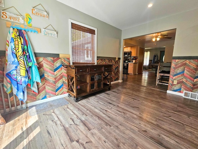 10040 S Reese Rd, Birch Run, MI 48415 - living area featuring a wainscoted wall, wood finished floors, ceiling fan, healthy amount of natural light, and recessed lighting