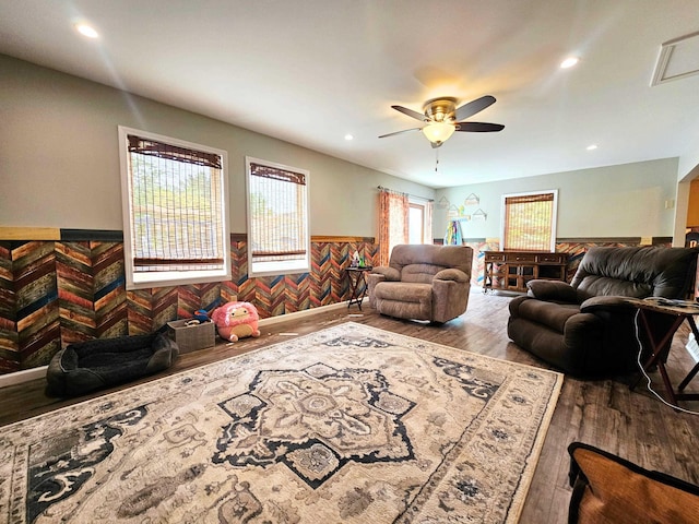 10040 S Reese Rd, Birch Run, MI 48415 - living room with a wainscoted wall, wood finished floors, a ceiling fan, and recessed lighting