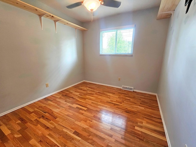 10040 S Reese Rd, Birch Run, MI 48415 - empty room featuring a ceiling fan, wood finished floors, and baseboards