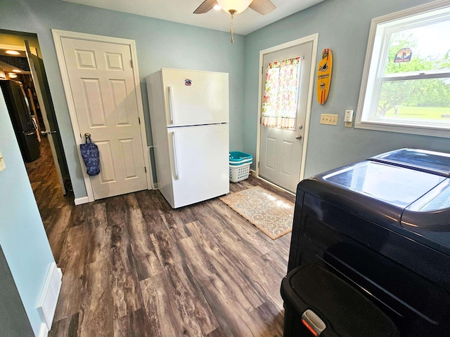 10040 S Reese Rd, Birch Run, MI 48415 - laundry room with a ceiling fan, dark wood-style floors, and baseboards